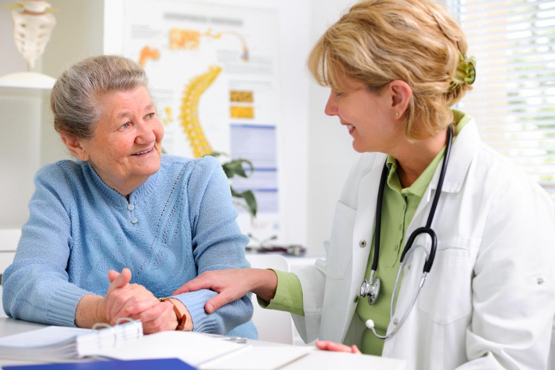 Older adult talking with a healthcare professional